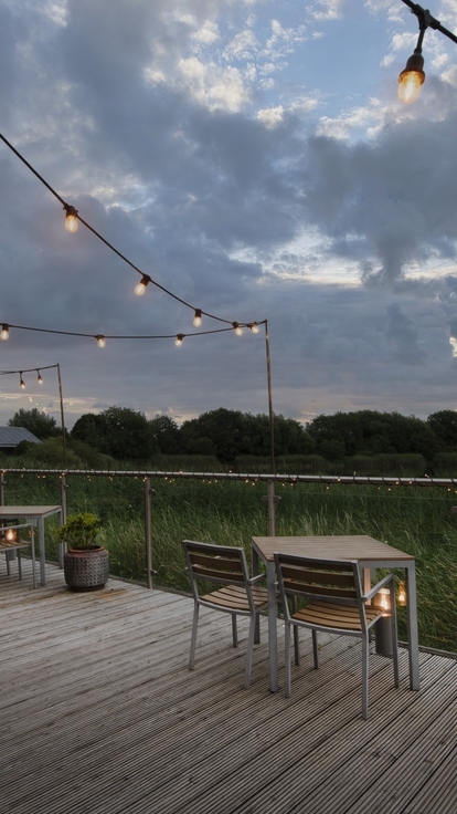 Old Boathouse - Terrace with lights on